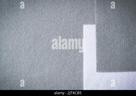 Abstract geometric felt texture background. White and gray colors felt textile for craft. Top view, flat lay Stock Photo