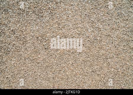 urban texture and background - building facade finished with fine gravel Stock Photo