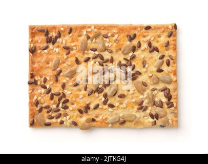 Top view of single wholegrain crispbread with various seeds isolated on white Stock Photo