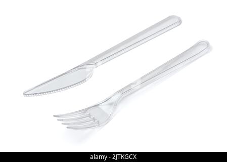 Transparent disposable plastic fork and knife  isolated on white Stock Photo
