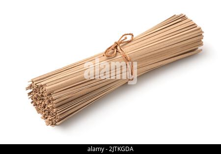 Bunch of uncooked buckwheat soba noodles isolated on white Stock Photo