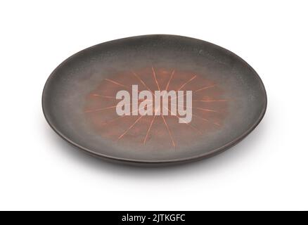 Empty handmade rough brown ceramic plate isolated on white Stock Photo