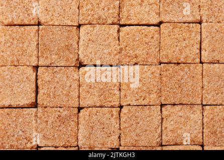Top view of brown sugar cubes texture background Stock Photo