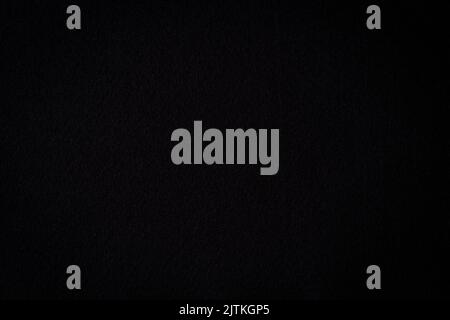 Black color felt textile fabric material texture background. Abstract monochrome black color background Stock Photo