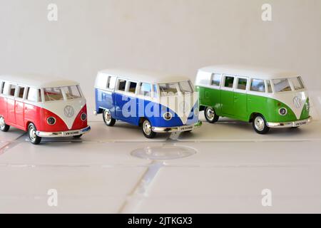 Diecast, Iron miniature, van in various colors, Brazil, South America, side view, selective focus, white background, with open doors, copy space Stock Photo