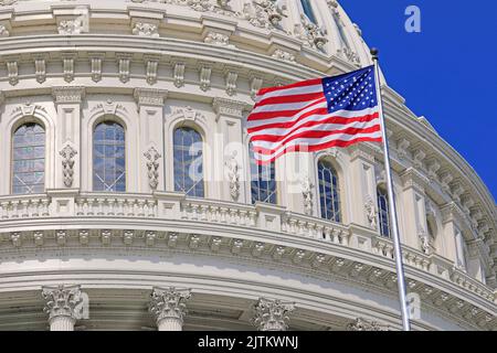 Washington DC Capitol dome detail with waving American flag Stock Photo