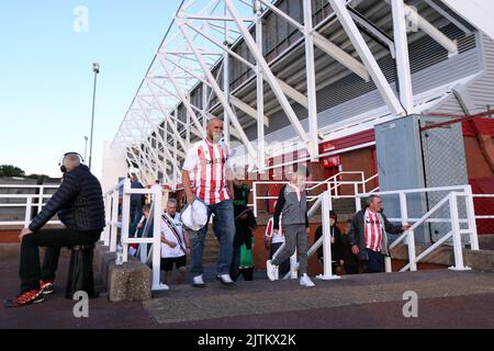 Stock City fans make their way to the stadium before the Sky Bet Championship match at the bet365 Stadium, Stoke-on-Trent. Picture date: Wednesday August 31, 2022. Stock Photo