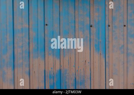 Rusty metal fence remain painted in places where it didn't fell off. Rustic texutre Stock Photo