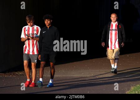 Stoke City fans make their way to the stadium before the Sky Bet Championship match at the bet365 Stadium, Stoke-on-Trent. Picture date: Wednesday August 31, 2022. Stock Photo