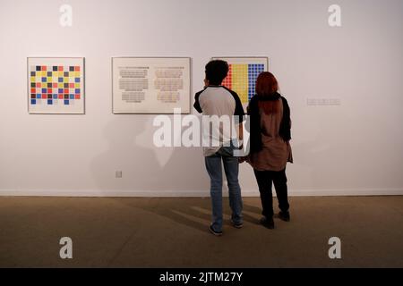 Tehran, Tehran, Iran. 30th Aug, 2022. People tour the Minimalism and Conceptual Art'' exhibition at the Tehran Museum of Contemporary Art in Iran on August 30, 2022. The show features the creations of 34 Western artists, representing contemporary western art for the first time in decades, according to the museum's official statement. The exhibition, which features pieces by American artists and features two styles of minimalism and conceptual art, is on display until September 18th. (Credit Image: © Shahrzad Vafa via ZUMA Press Wire) Stock Photo