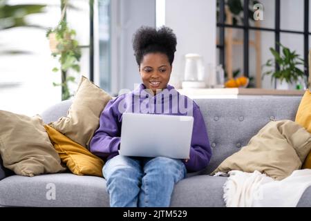 Freelance woman using laptop with CUSTOMER EXPERIENCE inscription ...