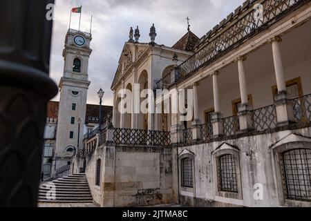 Iconic view of the Faculty of Law 'Faculdade de Direito' with the Tower Clock in the Campus of the University of Coimbra. Stock Photo