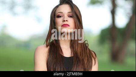 Annoyed attracrtive woman rejecting with hand and finger telling viewer NO, defending stand Stock Photo