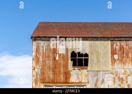 detail image of an old rusted building at the Greenport Yacht and ship building Company in Greenport, NY Stock Photo