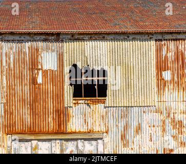 detail image of an old rusted building at the Greenport Yacht and ship building Company in Greenport, NY Stock Photo