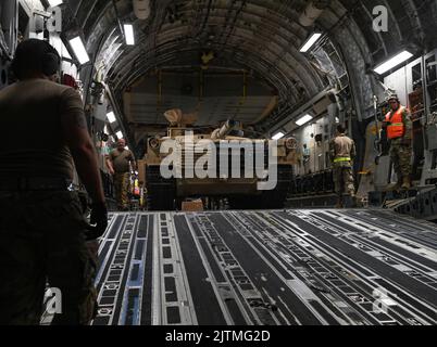 An M-1/A2 Abrams main battle tank is loaded onto an 816th Expeditionary Airlift Squadron C-17 Globemaster III aircraft Aug 27, 2022 at Ali Al Salem Air Base, Kuwait. The tank was transported to an undisclosed location. (U.S. Air National Guard photo by Master Sgt. Michael J. Kelly) Stock Photo