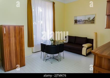 Comfortable Leather Sofa In the Dining Room Stock Photo