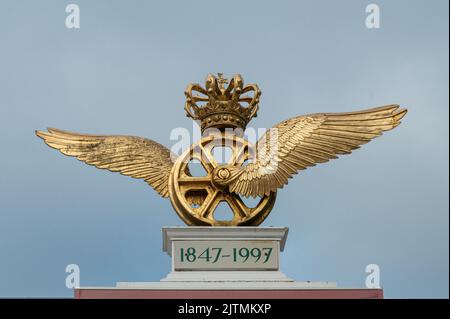 railway wheel with wings and a crown is the emblem of the danish railway company, Odense, Denmark, August 28, 2022 Stock Photo
