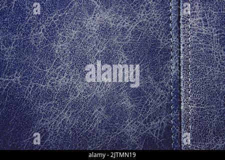 Texture blue leather with a vertical seam, closeup background Stock Photo