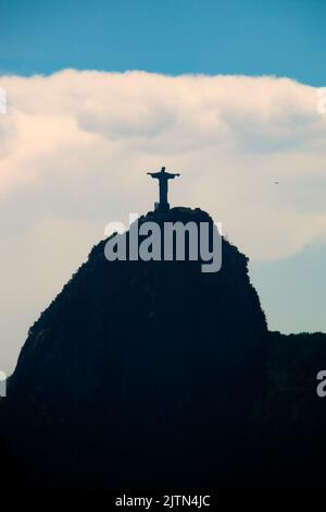 silhouette of the statue of Christ the Redeemer in Rio de Janeiro, Brazil - December 20, 2020: silhouette of the Statue of Christ the Redeemer, one of Stock Photo