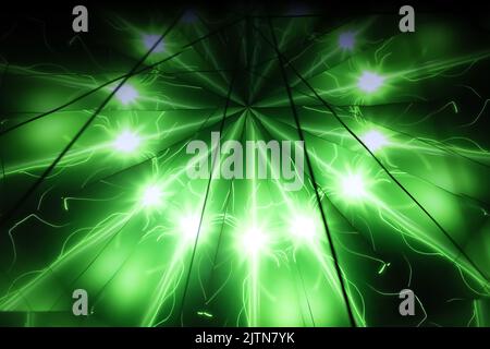 Bright radiant stars on green neon rays create a fractal pattern Stock Photo