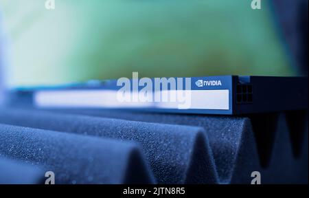 London, United Kingdom - Aug 5, 2022: Green color cast over close-up of engraved text RTX a4000 on Nvidia RTX A4000 Ampere workstation professional video card GPU for CAD CGI scientific machine learning - most powerful single-slot GPU for professionals Stock Photo