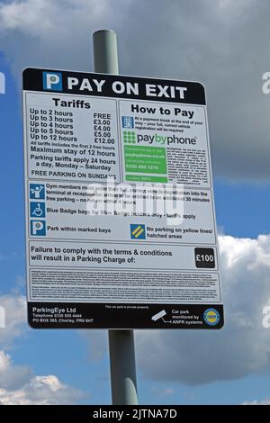 Parking signs,charges from PayByPhoone and ParkingEye, at Cockhedge Shopping & retail park at Warrington Town Centre,Cheshire,UK, WA1 Stock Photo