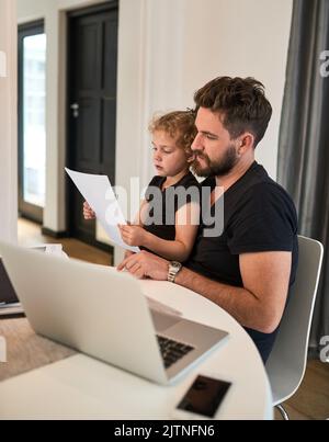 I will help sort your paperwork in no time Dad. a father and daughter bonding together at home. Stock Photo