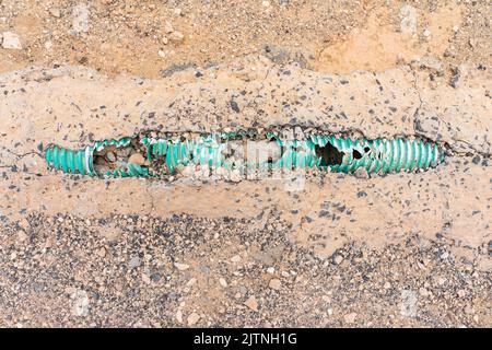 Cemented and damaged electrical cable channel. Stock Photo