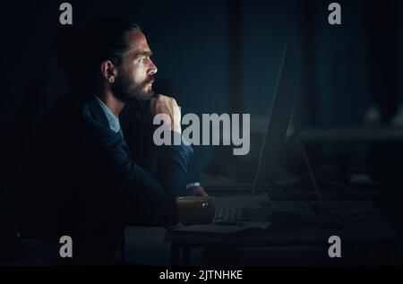 Digital programmer, cyber security and programmer with computer thinking and planning of web design at night. Engineer, developer and man working on Stock Photo