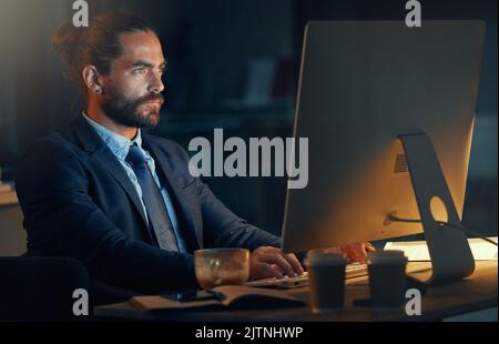 Tech, software and computer web design worker working at night on cyber security, programming or coding erp system. Information technology employee Stock Photo