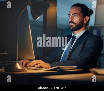 Working, typing and computer research of a seo and cryptocurrency technology developer working late. Web development of a fintech software worker Stock Photo