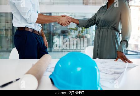 Architecture, shaking hands and a thank you handshake by engineer with a successful business customer. Professional b2b partnership deal or agreement Stock Photo