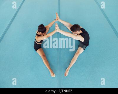 Dance or gymnastics fitness stretching couple, exercise and workout for dancing or gymnastics. Sport, health and flexibility training for a creative Stock Photo