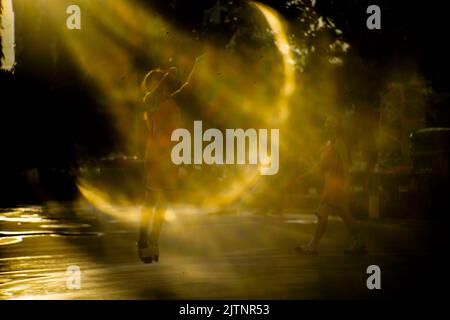 Strange effects from camera lenses create sunlight. Light pants surrounding people or objects are the technology of ancient len cametra Stock Photo
