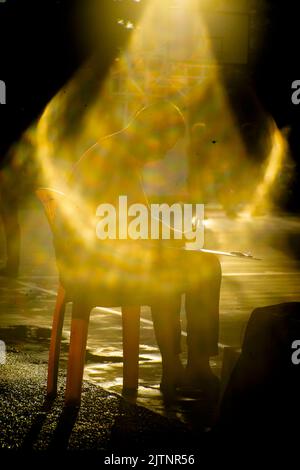 Strange effects from camera lenses create sunlight. Light pants surrounding people or objects are the technology of ancient len cametra Stock Photo
