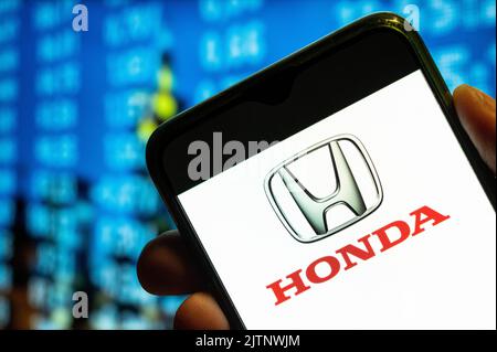 In this photo illustration, the Japanese automobile multinational conglomerate Honda logo is displayed on a smartphone screen. Stock Photo