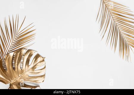 Palm leaf shadow on white wall and cream pastel floor. Abstract background of shadows palm leaf for creative summer minimal mock-up. Neutral tropical Stock Photo