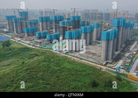 NANJING, CHINA - SEPTEMBER 1, 2022 - A residential housing site under construction in Nanjing, Jiangsu Province, China, Sept 1, 2022. In the first eig Stock Photo