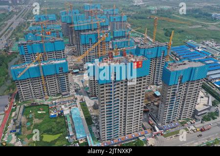 NANJING, CHINA - SEPTEMBER 1, 2022 - A residential housing site under construction in Nanjing, Jiangsu Province, China, Sept 1, 2022. In the first eig Stock Photo