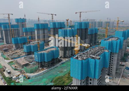 NANJING, CHINA - SEPTEMBER 1, 2022 - A residential housing site under construction in Nanjing, Jiangsu Province, China, Sept 1, 2022. In the first eig Stock Photo