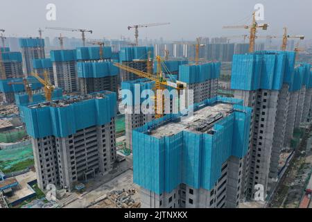 NANJING, CHINA - SEPTEMBER 1, 2022 - A residential housing site under construction in Nanjing, Jiangsu Province, China, Sept 1, 2022. In the first eig Stock Photo