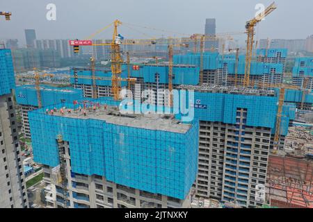 NANJING, CHINA - SEPTEMBER 1, 2022 - A residential housing site under construction in Nanjing, Jiangsu Province, China, Sept 1, 2022. In the first eig Stock Photo