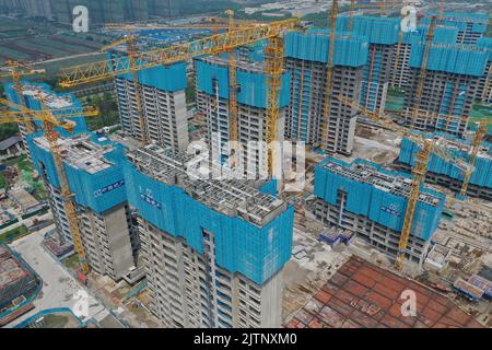 NANJING, CHINA - SEPTEMBER 1, 2022 - A residential housing site under construction in Nanjing, Jiangsu Province, China, Sept 1, 2022. In the first eig Stock Photo