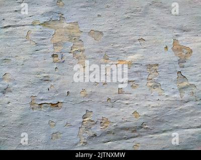 Old beige black and white stone wall background texture close up Stock Photo