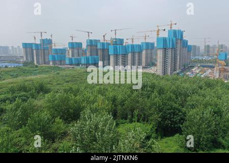 NANJING, CHINA - SEPTEMBER 1, 2022 - A residential housing site under construction in Nanjing, Jiangsu Province, China, Sept 1, 2022. In the first eig Stock Photo