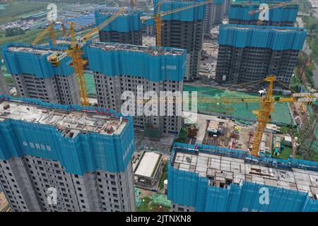 NANJING, CHINA - SEPTEMBER 1, 2022 - A residential housing site under construction in Nanjing, Jiangsu Province, China, Sept 1, 2022. In the first eig Stock Photo