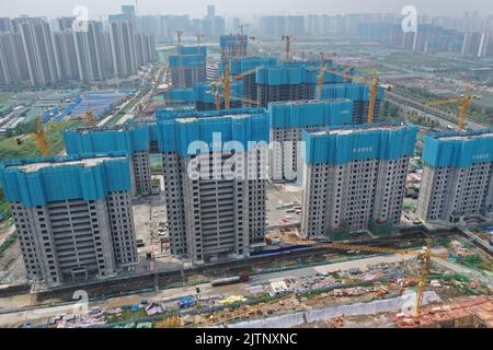 NANJING, CHINA - SEPTEMBER 1, 2022 - A residential housing site under construction in Nanjing, Jiangsu Province, China, Sept 1, 2022. In the first eig Stock Photo