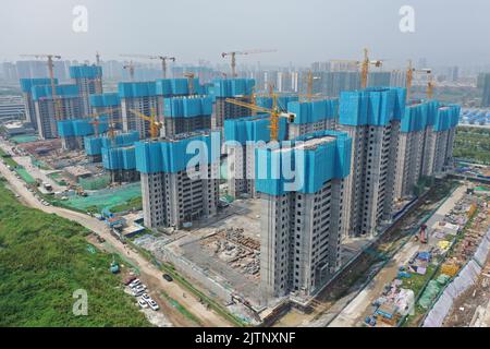 NANJING, CHINA - SEPTEMBER 1, 2022 - A residential housing site under construction in Nanjing, Jiangsu Province, China, Sept 1, 2022. In the first eig Stock Photo