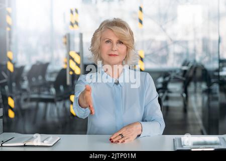 welcome assured lady hand outstretched employment Stock Photo